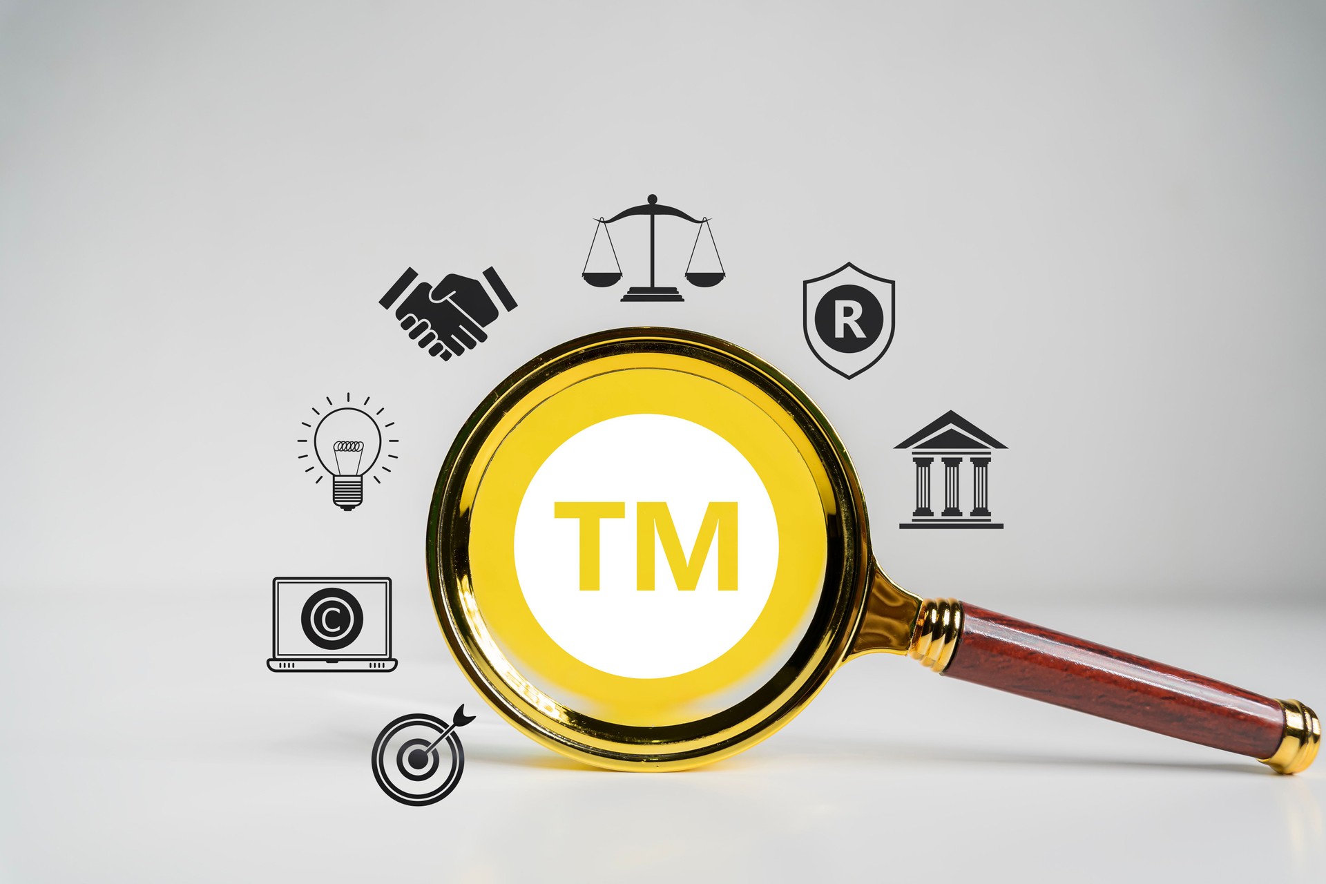 TM, Trademark Protection, Intellectual Property Concept. Magnifying glass with TM symbol